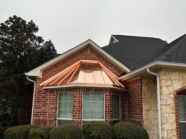 Ultimate Rain Gutters & Roofing at work